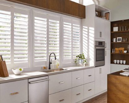 White plantation shutters in a modern kitchen