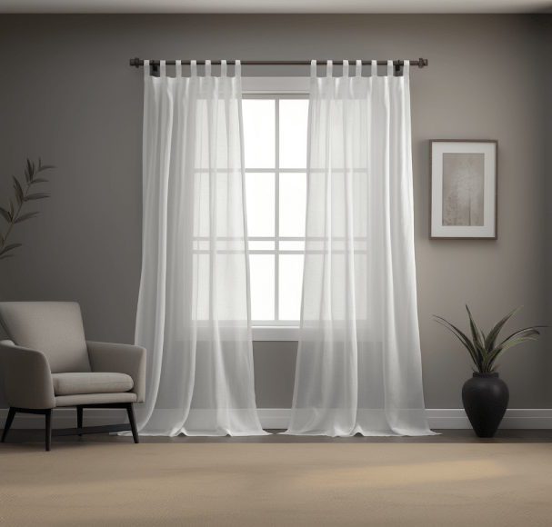 Living room with sheer white curtains over a large window